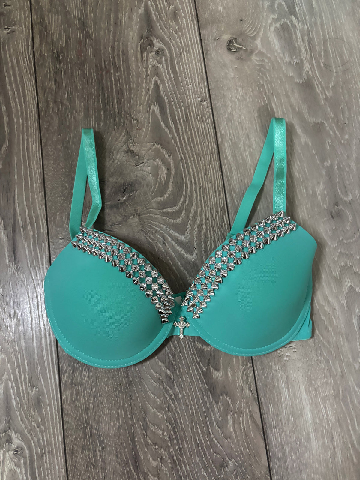 Turquoise single strip spiked (with cross) push up bra