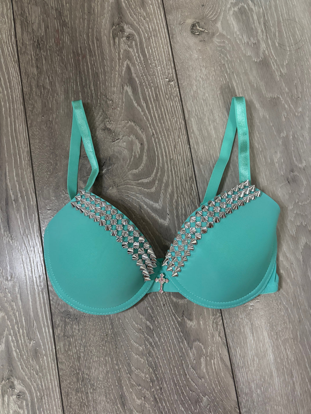 Turquoise single strip spiked (with cross) push up bra