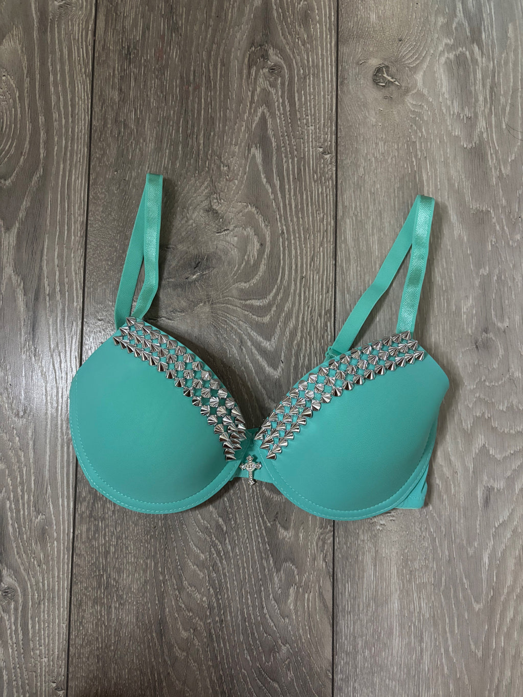 Turquoise single strip spiked (with cross) push up bra
