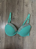 Turquoise single strip spiked (with cross) push up bra