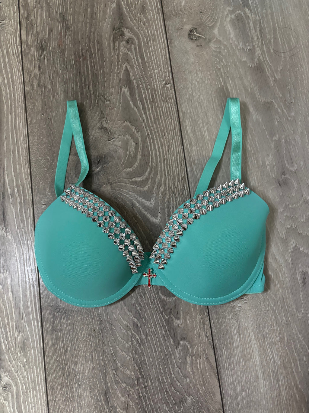 Turquoise single strip spiked (with cross) push up bra