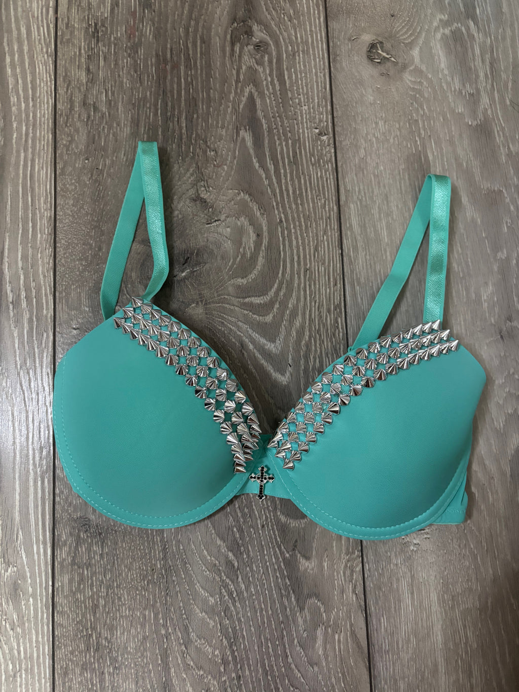 Turquoise single strip spiked (with cross) push up bra