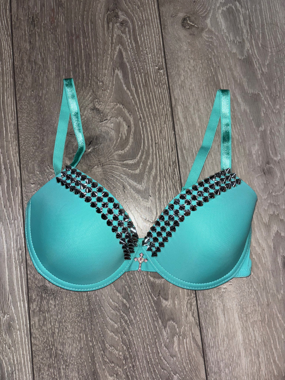 Turquoise single strip spiked (with cross) push up bra
