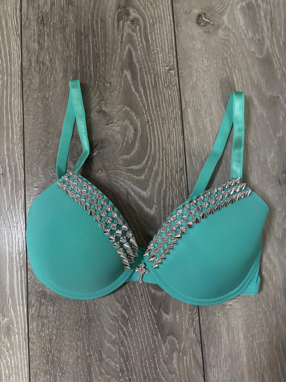 Turquoise single strip spiked (with cross) push up bra