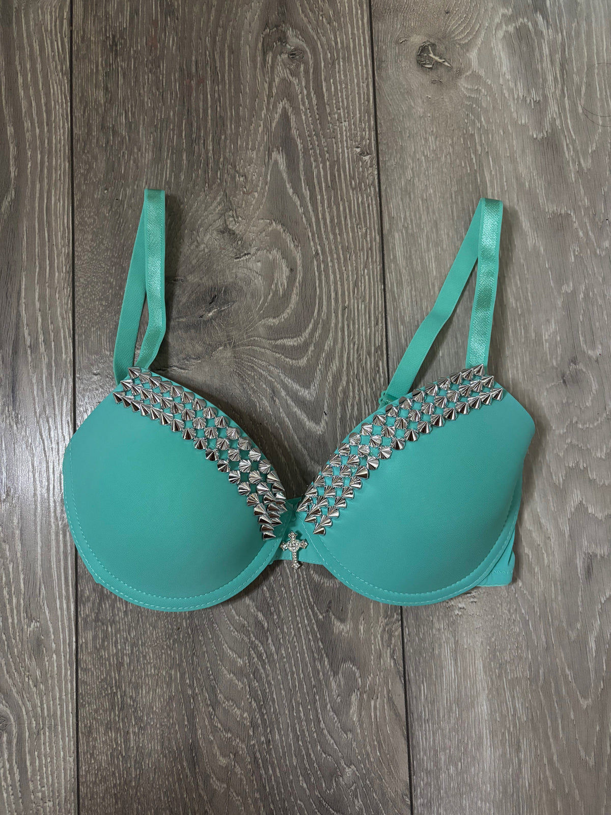 Turquoise single strip spiked (with cross) push up bra