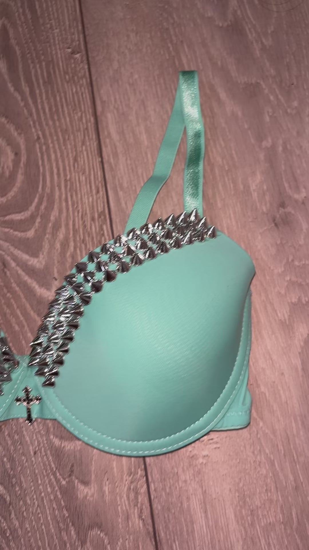 Turquoise single strip spiked (with cross) push up bra